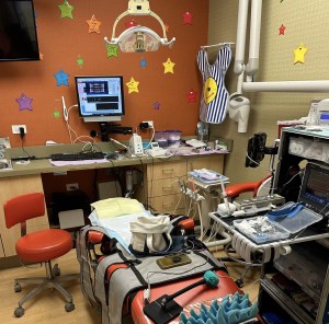 Pediatric dental treatment room with colorful decorations and sedation dentistry equipment, used by Dr. Loretta Smith