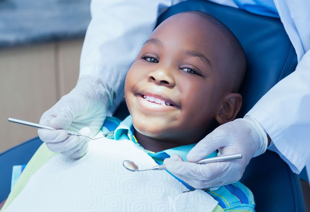 Child being examined by pediatric dentist